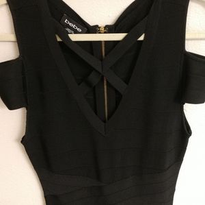 Bebe black bodycon dress in size M